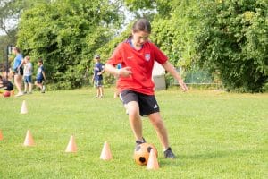 camp mirage girl playing soccer