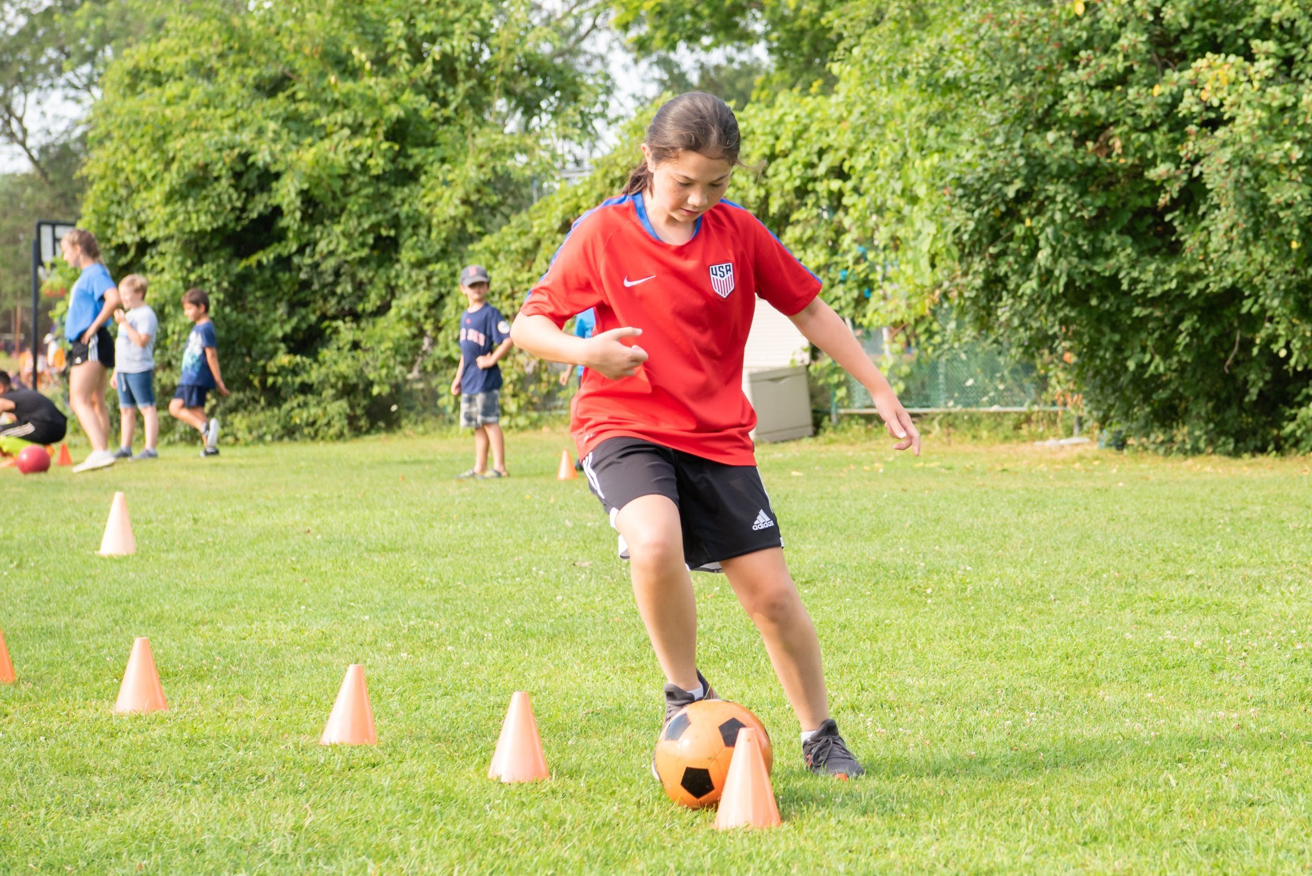 camp mirage girl playing soccer