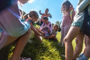 group of campers hanging out with a counselor